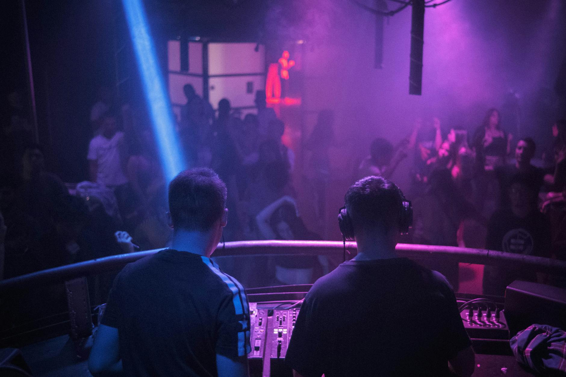 Nightclub dance floor with DJ in Milan