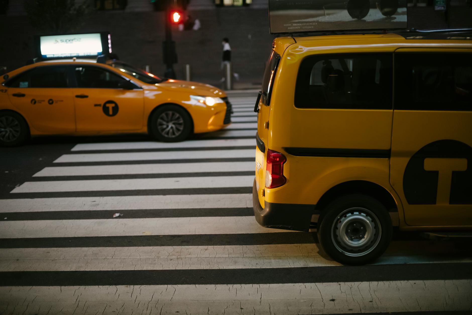 Taxi cab on a city street at night