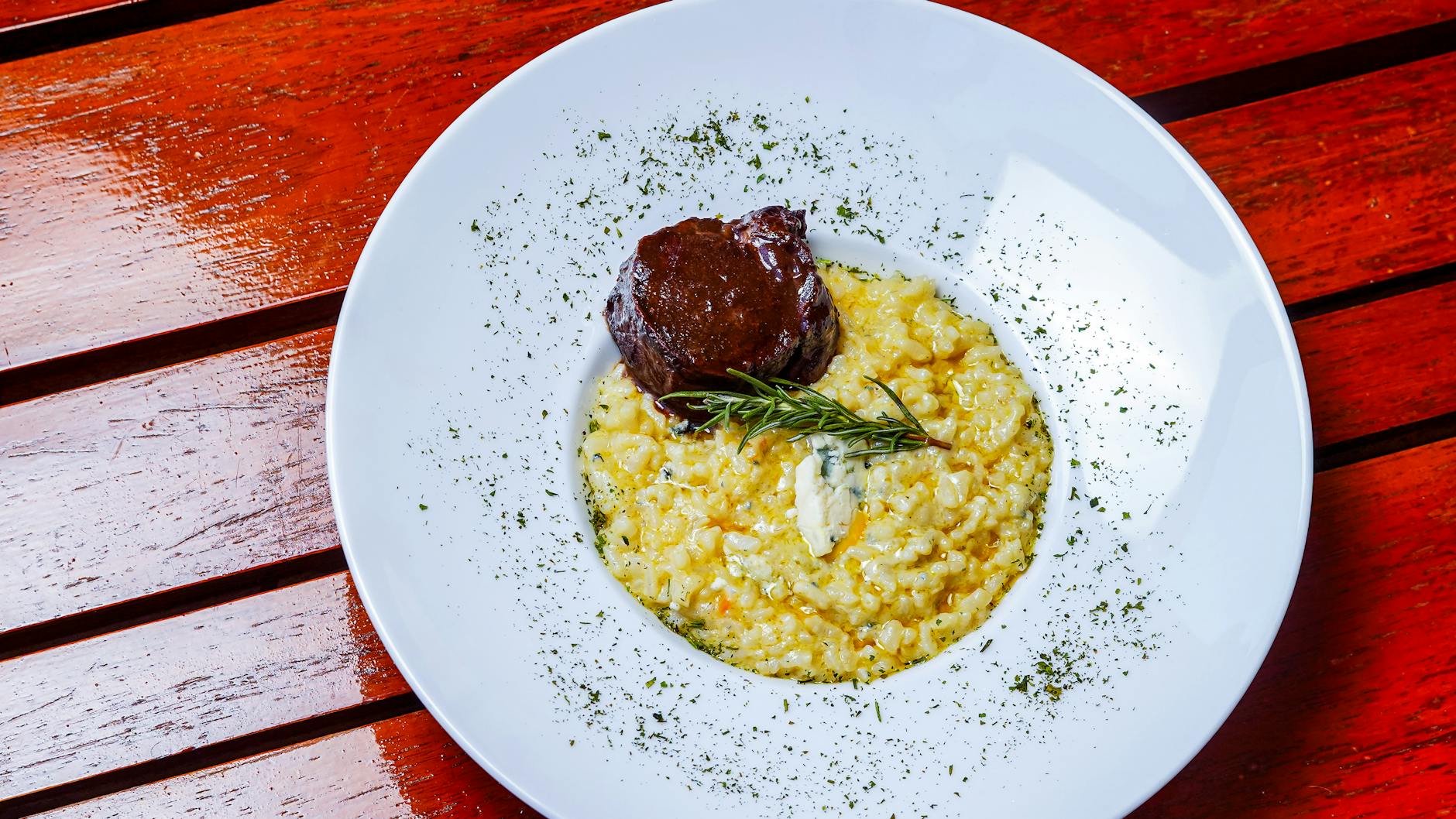 Traditional Risotto alla Milanese with saffron on a plate