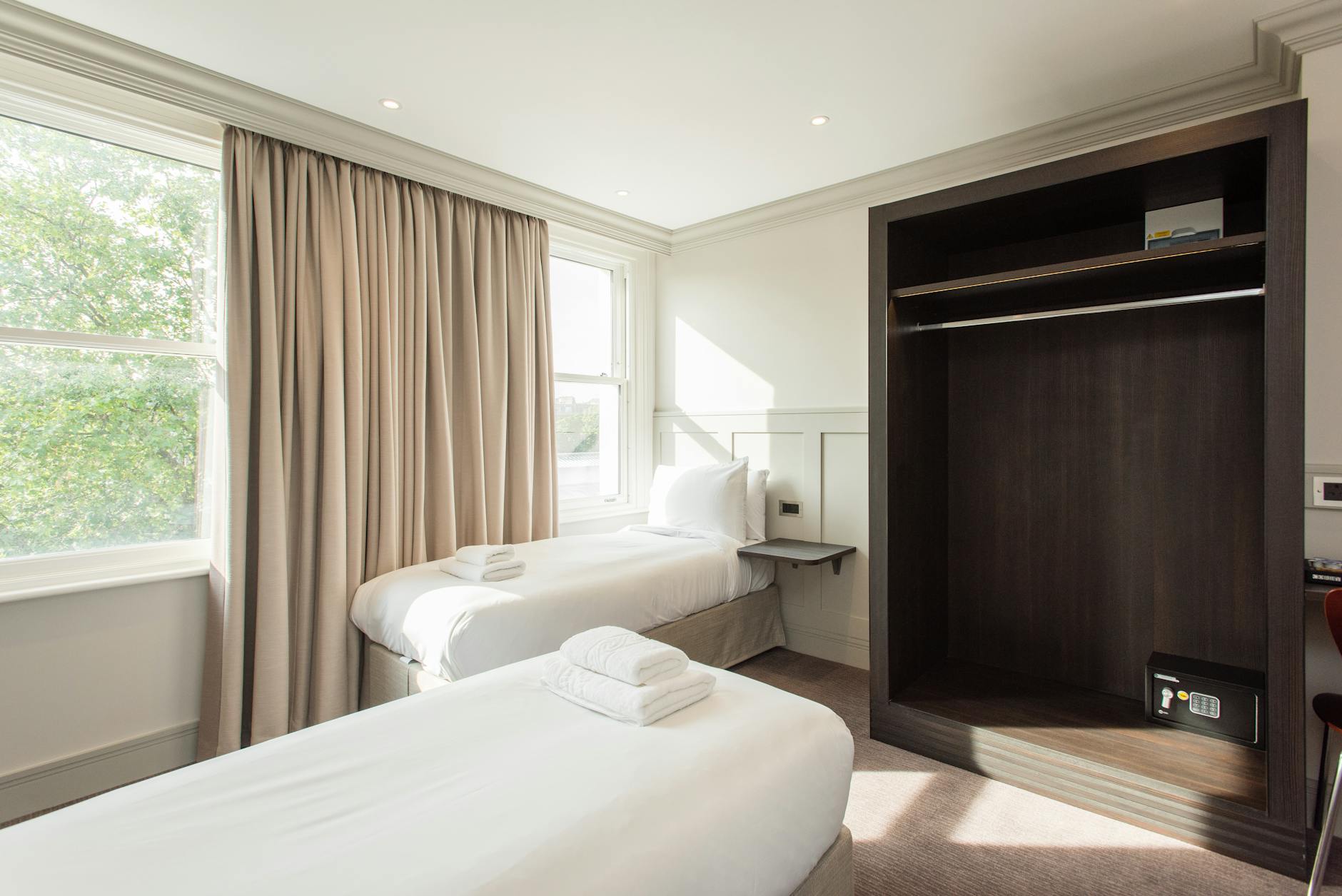 Clean simple budget hotel room in Milan with basic comforts
