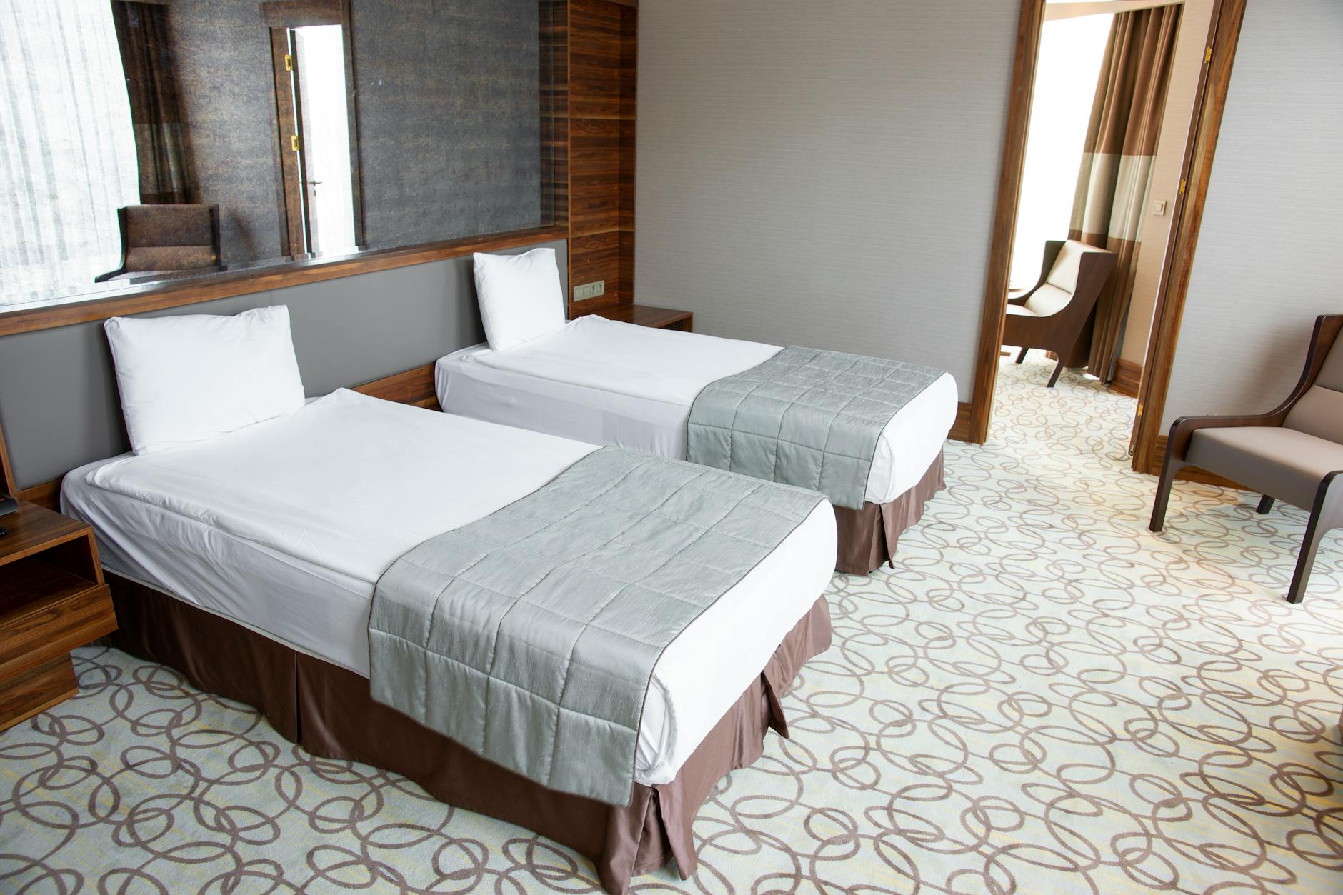 Spacious family hotel room in Milan with multiple beds