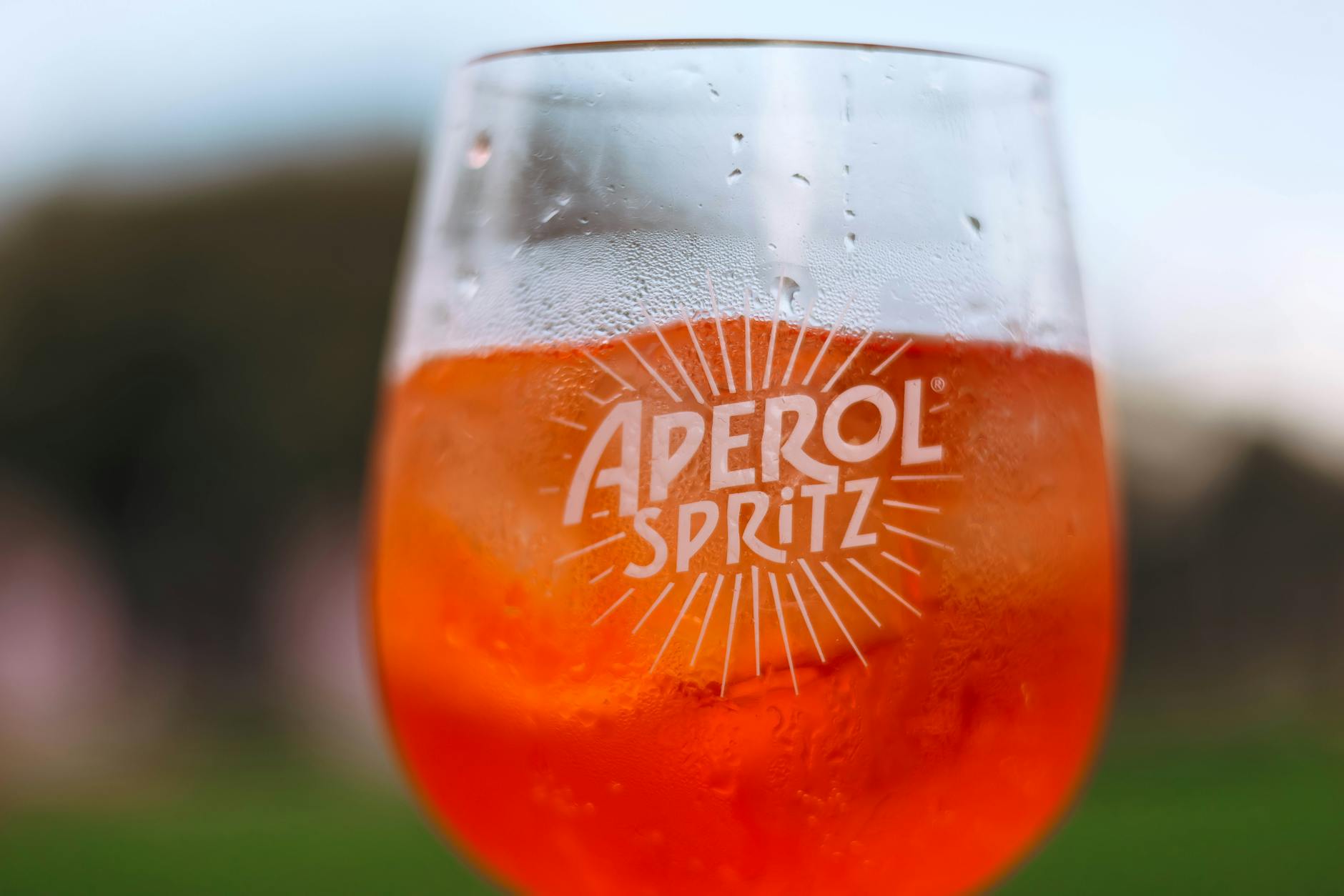 Italian aperitivo with Aperol Spritz cocktail traditional Milan