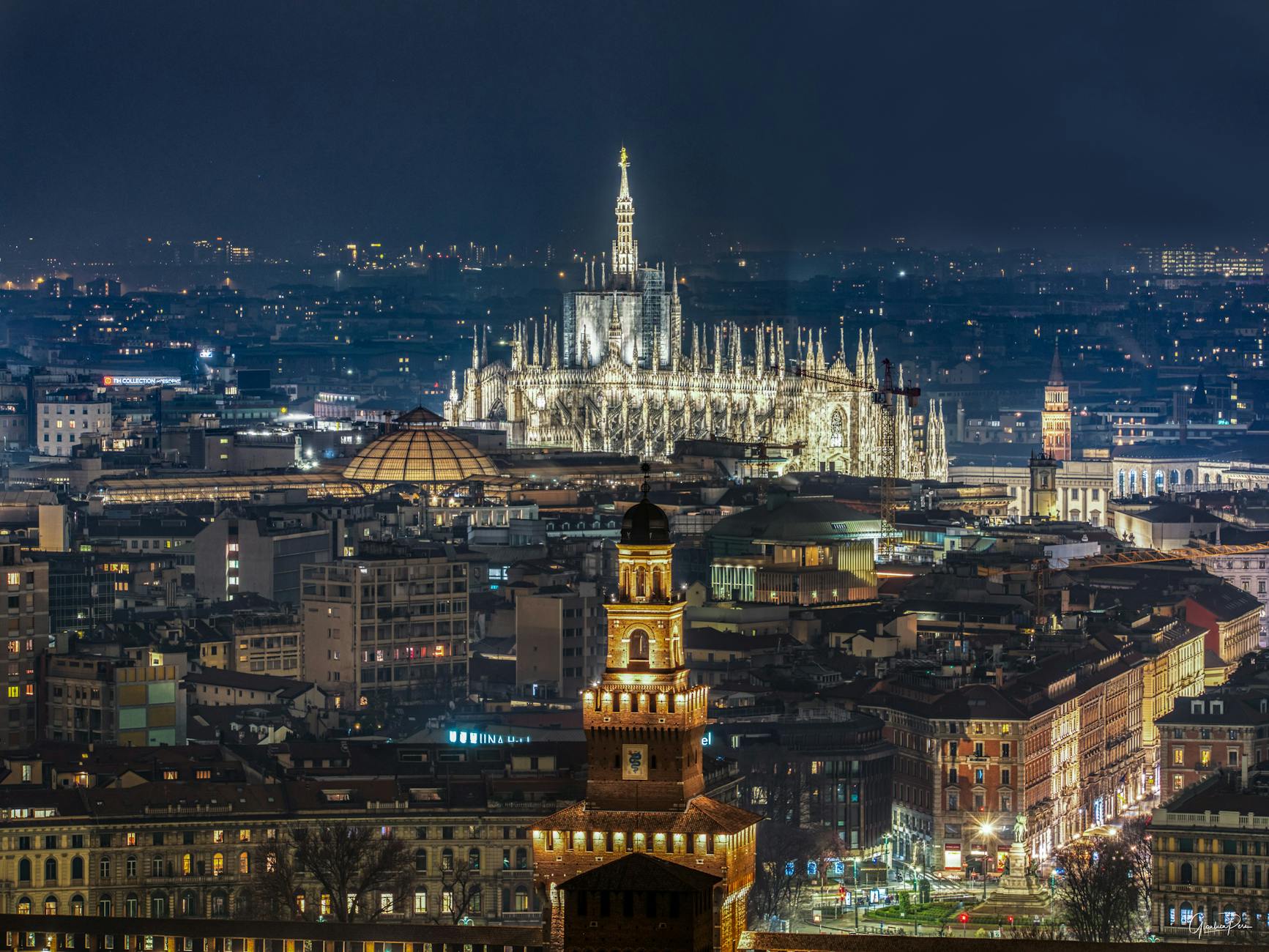 Milan skyline at night seen from luxury hotel