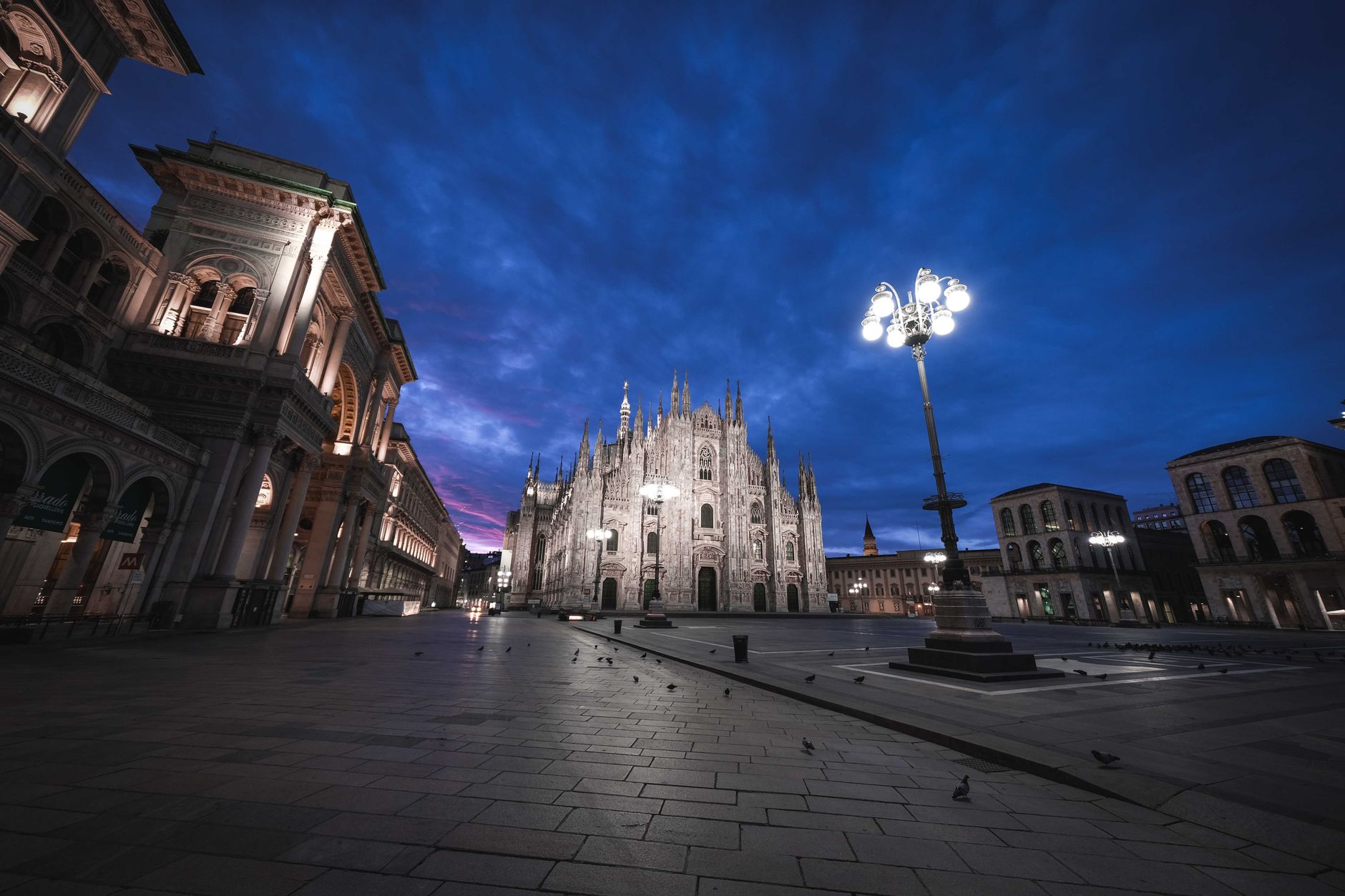 Wide shot of Piazza Duomo at dusk with the giant Christmas tree