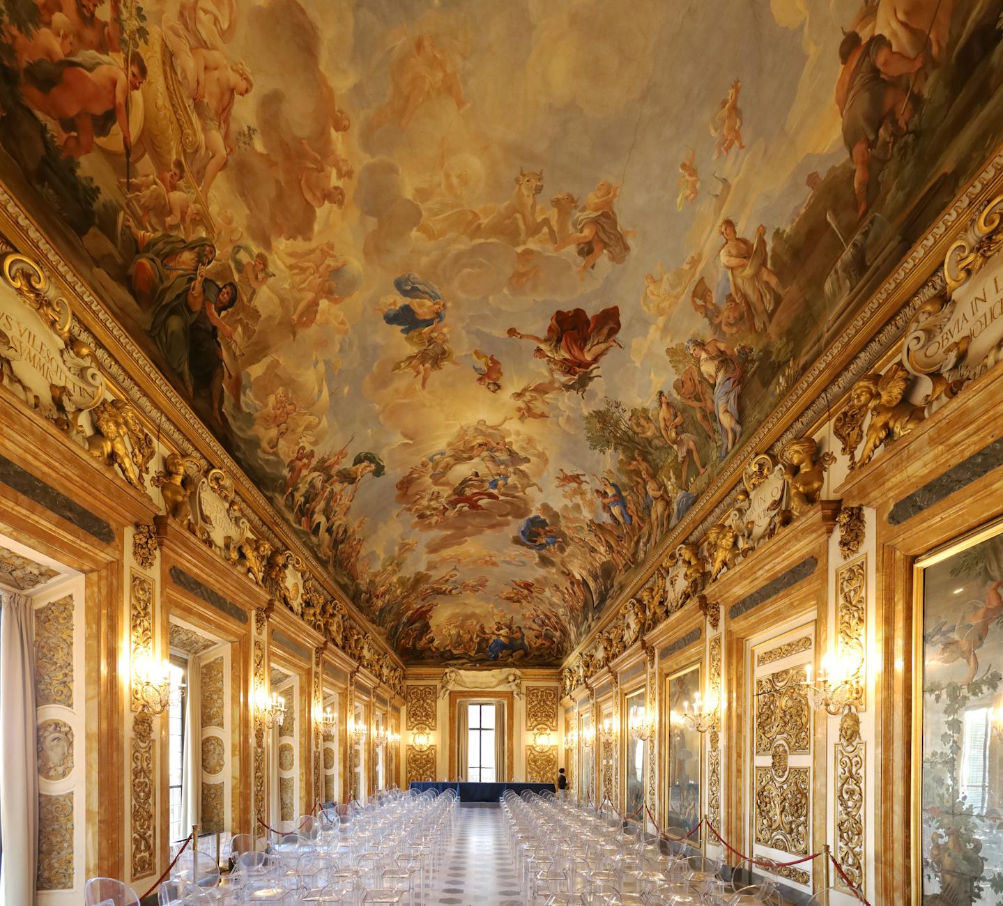 Interior of a Milanese palazzo opened for FAI Giornate d'Autunno, frescoed ceiling, small group of visitors looking up,