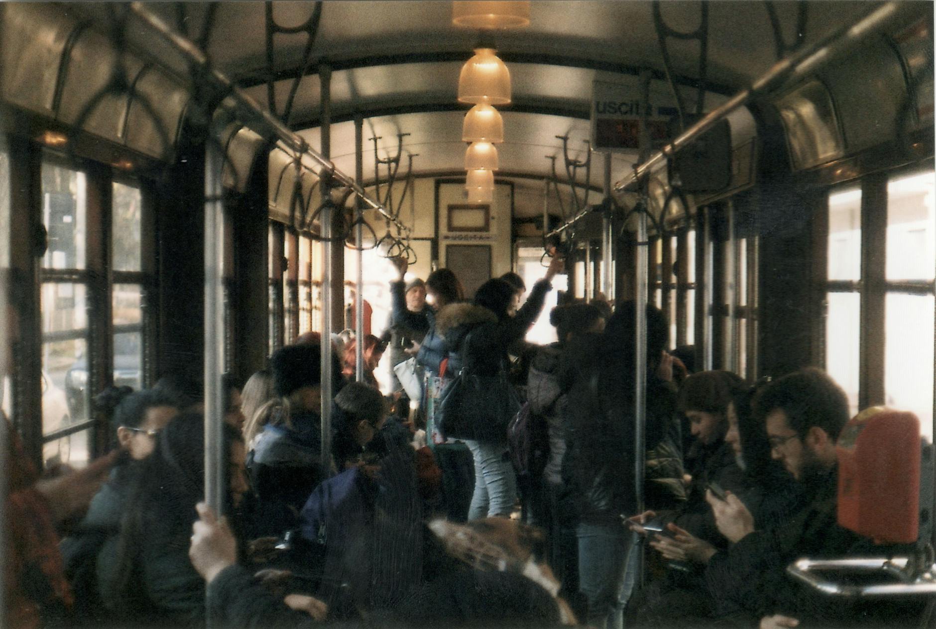 milan metro carriage interior passengers