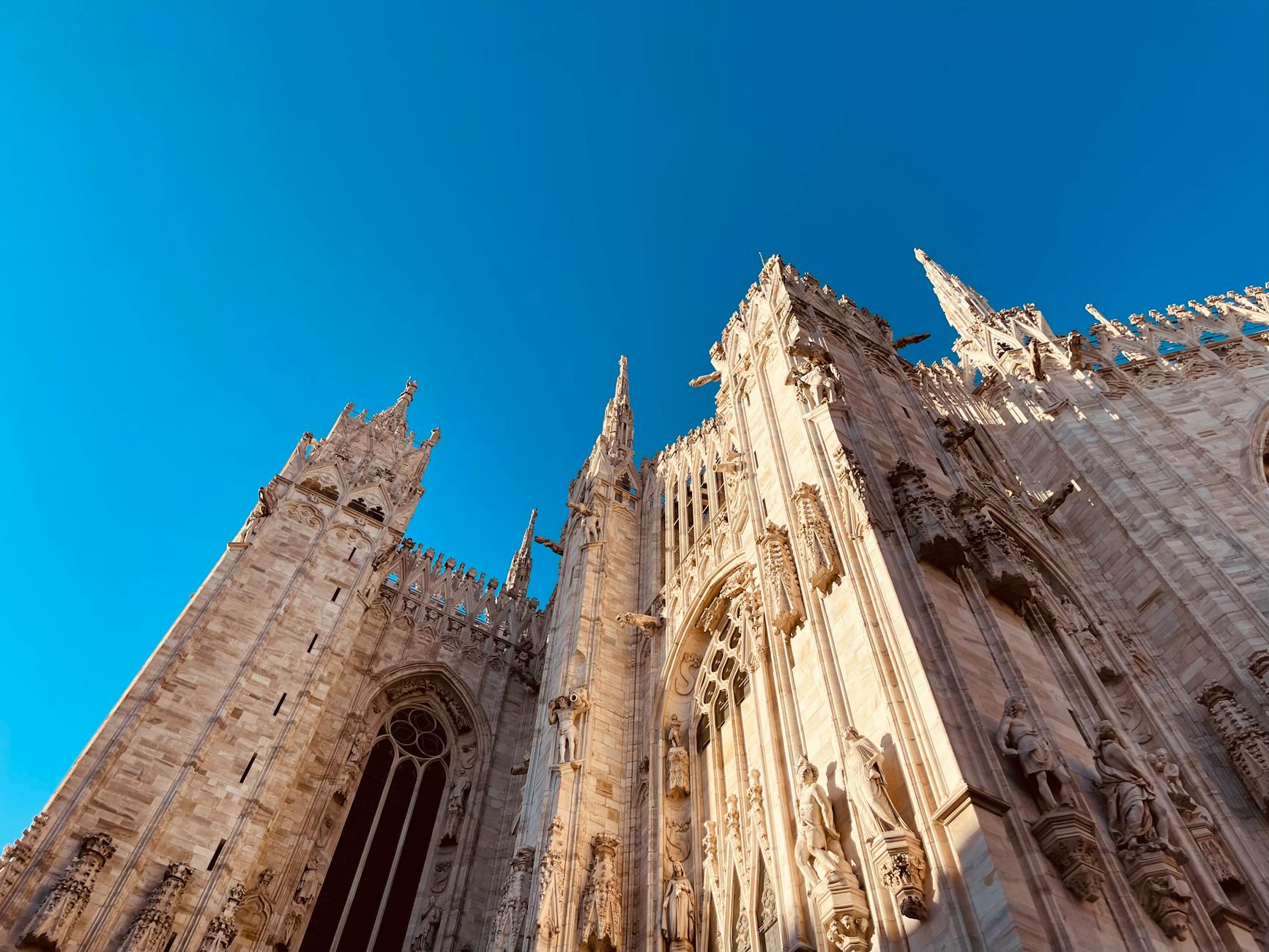 Milan Duomo on a clear spring morning with light cloud cover, placeholder