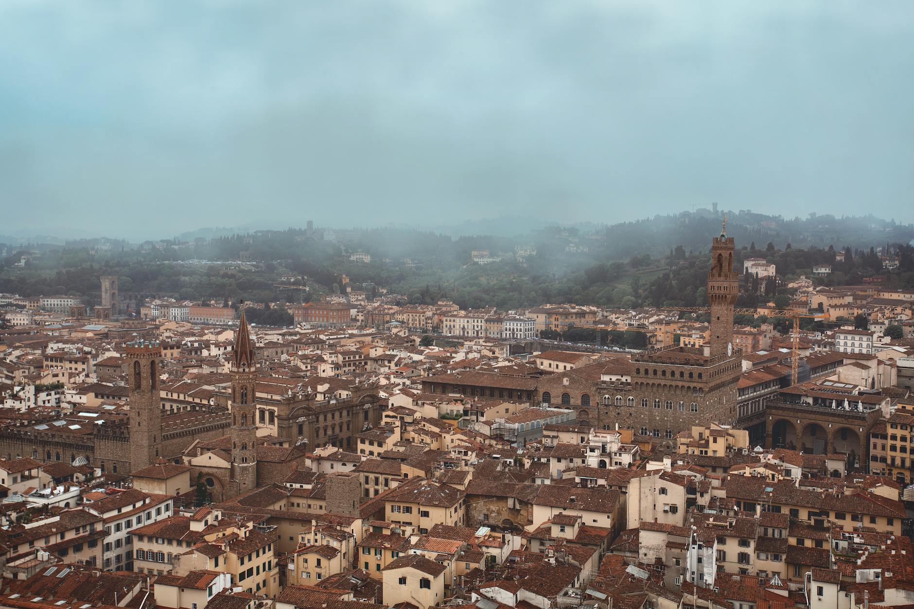 Foggy morning at the Duomo of Milan with low cloud over the spires