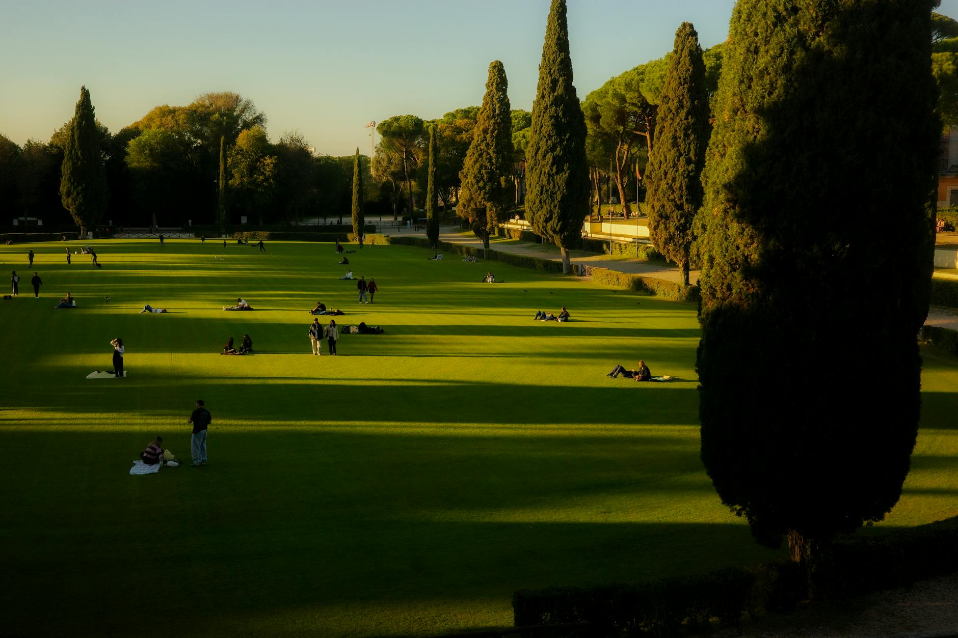 People relaxing in a Lazio park during a tranquil evening