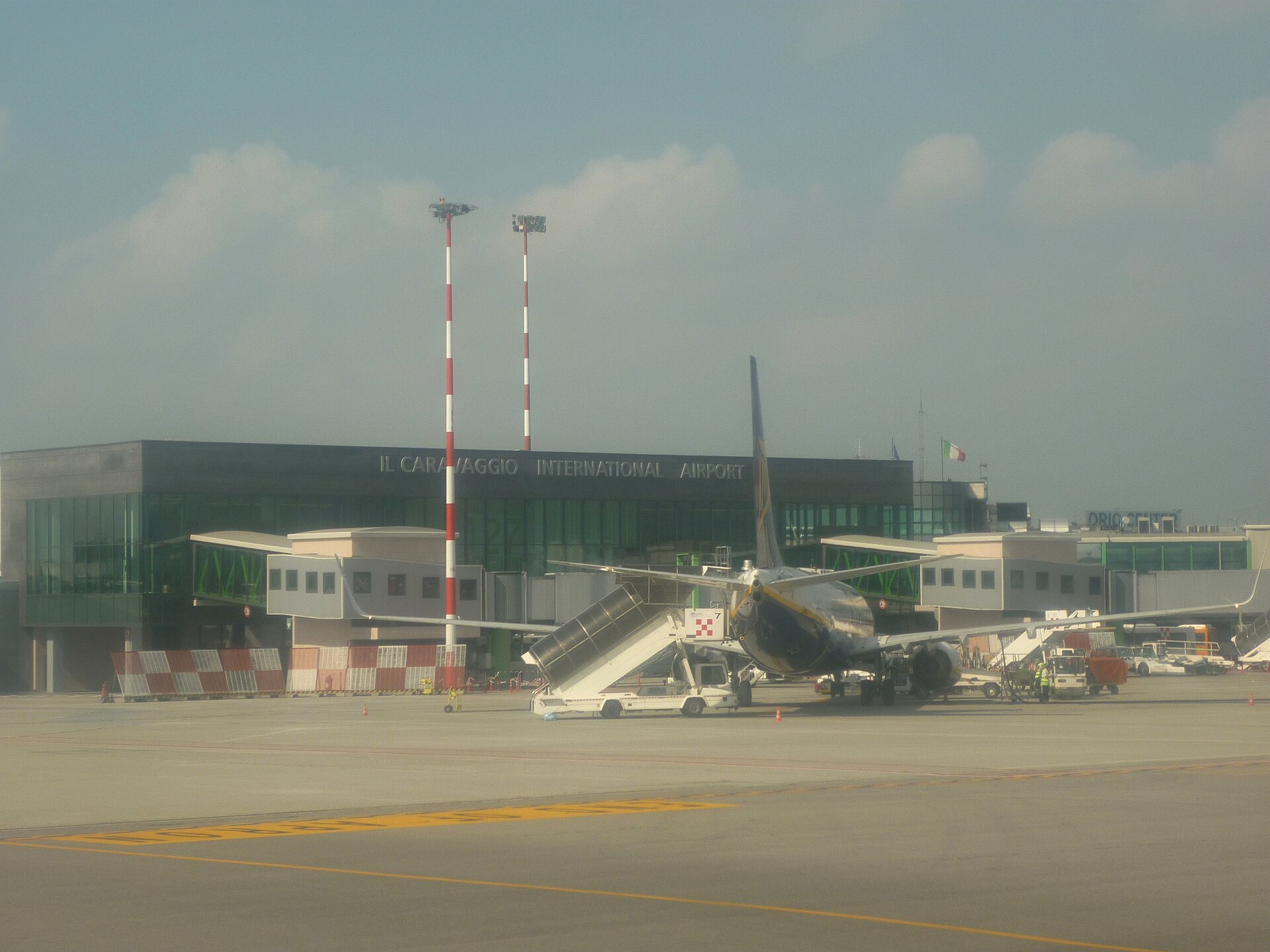 Il Caravaggio International Airport terminal at Bergamo Orio al Serio with a Ryanair aircraft on stand